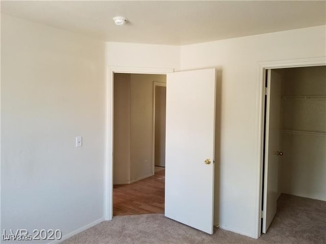 9937 La Paca Ave, Las Vegas, NV 89117 - unfurnished bedroom featuring carpet, a walk in closet, and a closet