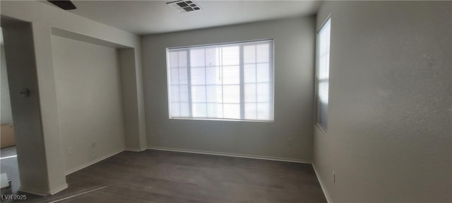 8695 Canfield Canyon Ave, Las Vegas, NV 89178 - unfurnished bedroom with multiple windows, wood finished floors, and baseboards