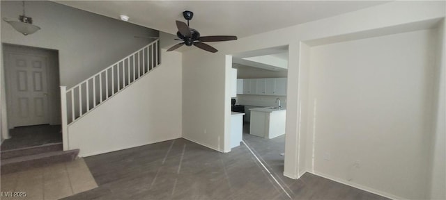 8695 Canfield Canyon Ave, Las Vegas, NV 89178 - staircase featuring a ceiling fan, baseboards, and concrete floors