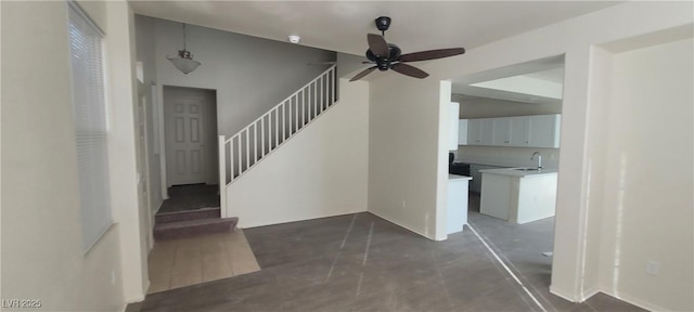 8695 Canfield Canyon Ave, Las Vegas, NV 89178 - stairs with ceiling fan and concrete flooring