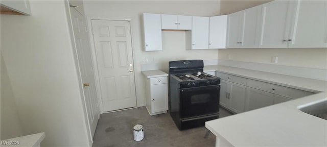 8695 Canfield Canyon Ave, Las Vegas, NV 89178 - kitchen featuring black gas stove, concrete flooring, white cabinetry, and light countertops