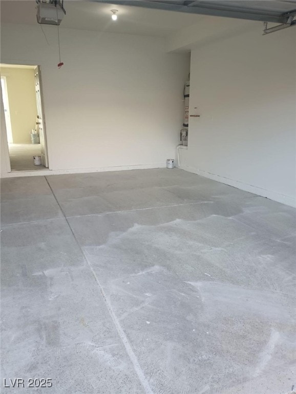 8695 Canfield Canyon Ave, Las Vegas, NV 89178 - garage with a garage door opener and water heater