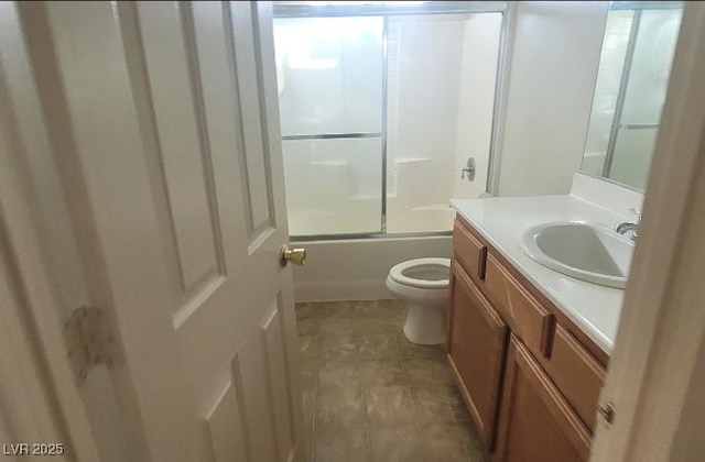 8695 Canfield Canyon Ave, Las Vegas, NV 89178 - full bathroom featuring vanity, toilet, and bath / shower combo with glass door