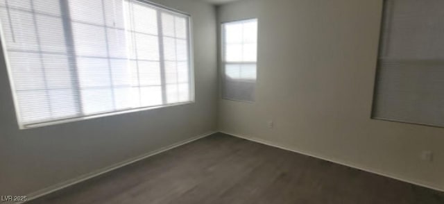 8695 Canfield Canyon Ave, Las Vegas, NV 89178 - unfurnished room featuring dark wood finished floors and baseboards