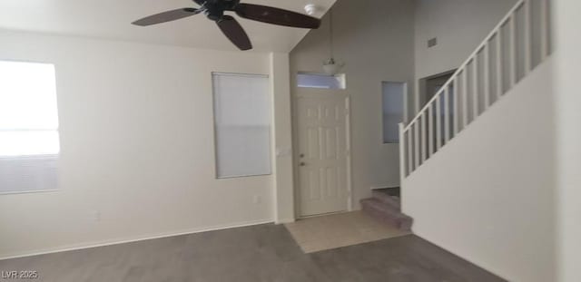 8695 Canfield Canyon Ave, Las Vegas, NV 89178 - foyer with ceiling fan, stairs, wood finished floors, vaulted ceiling, and baseboards