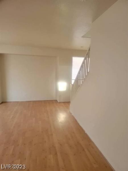 8149 Palace Monaco Ave, Las Vegas, NV 89117 - unfurnished living room featuring light wood-type flooring