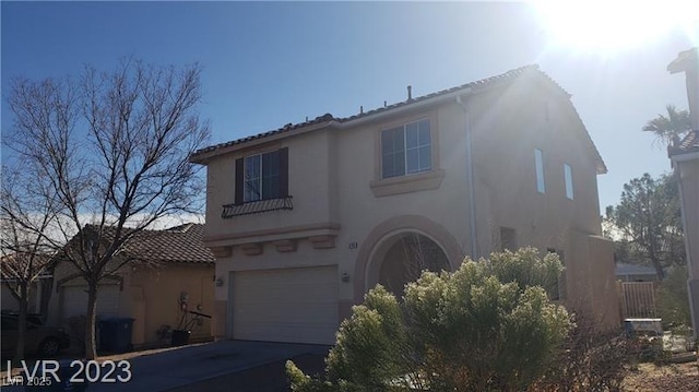 8149 Palace Monaco Ave, Las Vegas, NV 89117 - view of front of house featuring stucco siding, concrete driveway, an attached garage, and a tiled roof