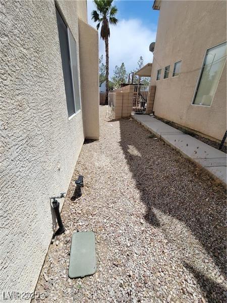 8149 Palace Monaco Ave, Las Vegas, NV 89117 - view of yard with a gate