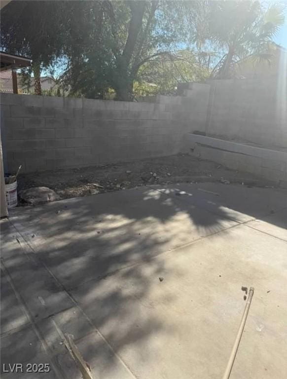 5115 Blossom Ave, Las Vegas, NV 89142 - fenced backyard with a patio area