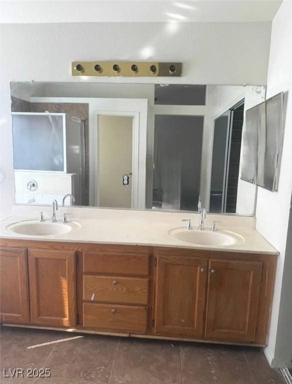5115 Blossom Ave, Las Vegas, NV 89142 - full bathroom featuring double vanity and tile patterned floors