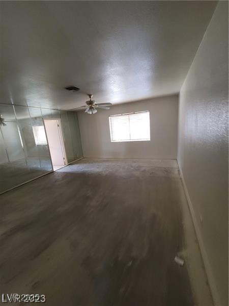3480 E Hacienda Ave, Las Vegas, NV 89120 - spare room featuring light wood-type flooring, baseboards, and a ceiling fan