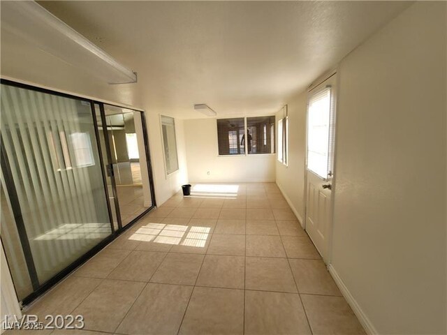 3480 E Hacienda Ave, Las Vegas, NV 89120 - tiled empty room featuring baseboards