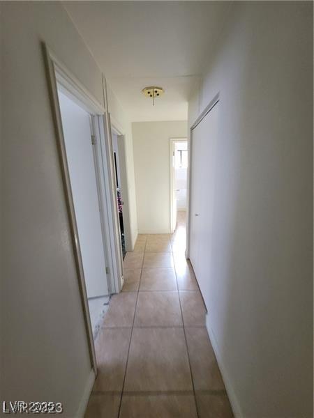3480 E Hacienda Ave, Las Vegas, NV 89120 - hallway with light tile patterned flooring