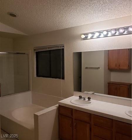 2720 Knightsbridge Rd, Henderson, NV 89074 - full bath with double vanity, a textured ceiling, lofted ceiling, a shower stall, and a bath