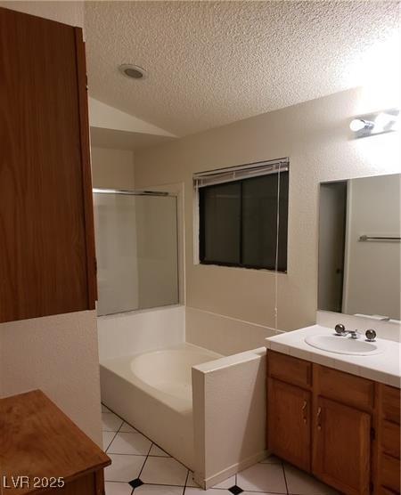 2720 Knightsbridge Rd, Henderson, NV 89074 - full bath with vaulted ceiling, vanity, a textured ceiling, a shower stall, and a bath