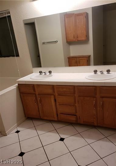 2720 Knightsbridge Rd, Henderson, NV 89074 - bathroom featuring double vanity and tile patterned flooring