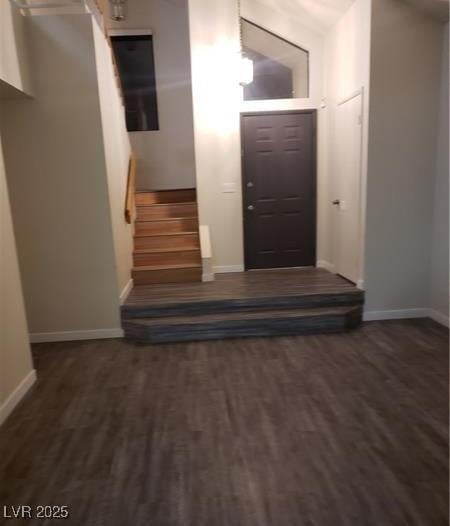 2720 Knightsbridge Rd, Henderson, NV 89074 - foyer entrance with baseboards, wood finished floors, and stairs