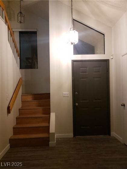 2720 Knightsbridge Rd, Henderson, NV 89074 - entrance foyer with stairway, baseboards, wood finished floors, and a chandelier