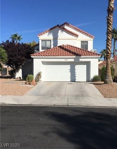 2720 Knightsbridge Rd, Henderson, NV 89074 - mediterranean / spanish-style house with driveway, a garage, a tiled roof, and stucco siding