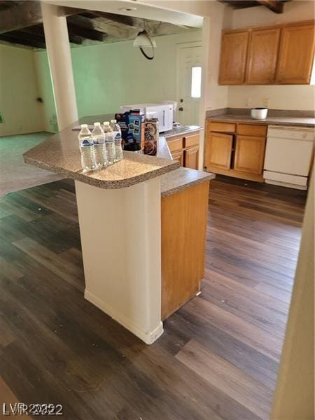 1413 Bryn Mawr Ave, Las Vegas, NV 89102 - kitchen with white appliances, dark wood-style floors, a kitchen island, and a kitchen bar