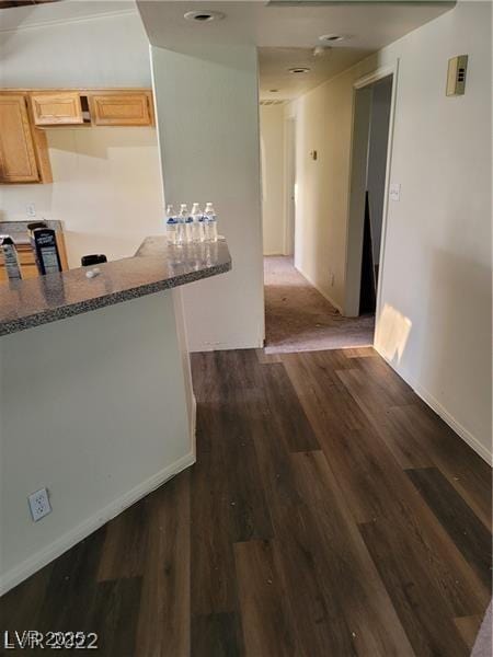 1413 Bryn Mawr Ave, Las Vegas, NV 89102 - kitchen with dark wood finished floors, light brown cabinetry, and baseboards