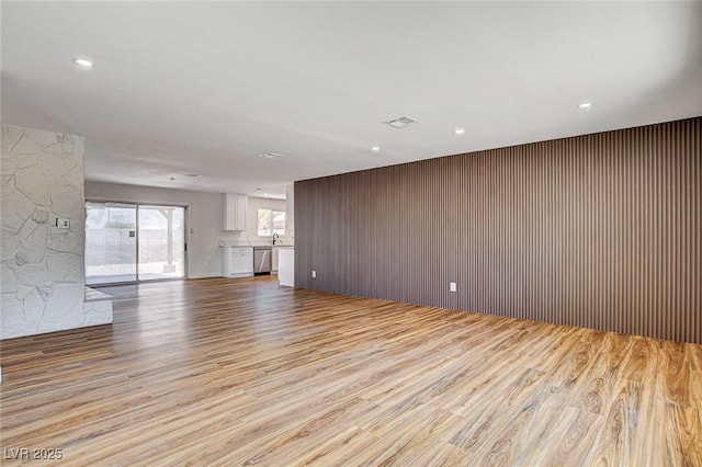 3386 El Camino Real, Las Vegas, NV 89121 - unfurnished living room with wood finished floors and recessed lighting