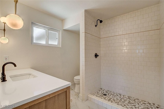 3386 El Camino Real, Las Vegas, NV 89121 - full bath featuring toilet, a tile shower, vanity, and marble look tiles