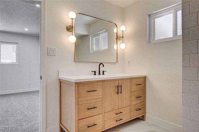3386 El Camino Real, Las Vegas, NV 89121 - bathroom with baseboards, vanity, and a textured ceiling