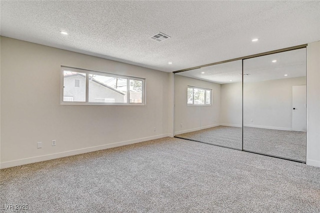 3386 El Camino Real, Las Vegas, NV 89121 - unfurnished bedroom with recessed lighting, carpet, baseboards, a textured ceiling, and a closet