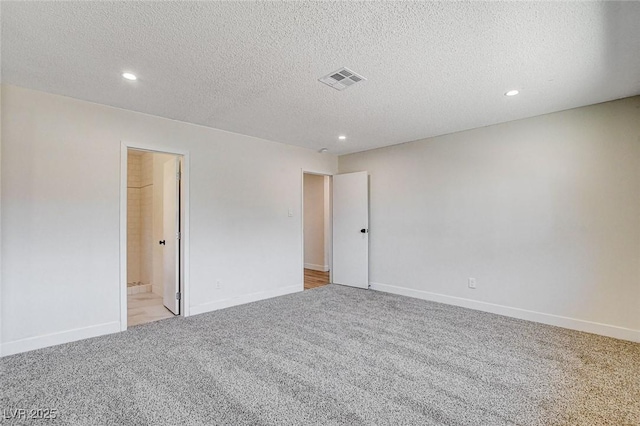 3386 El Camino Real, Las Vegas, NV 89121 - unfurnished room featuring recessed lighting, light carpet, a textured ceiling, and baseboards