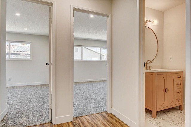 3386 El Camino Real, Las Vegas, NV 89121 - bathroom with vanity, baseboards, recessed lighting, and a textured ceiling