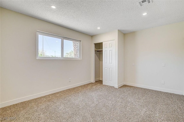 3386 El Camino Real, Las Vegas, NV 89121 - unfurnished bedroom with carpet flooring, recessed lighting, a textured ceiling, a closet, and baseboards
