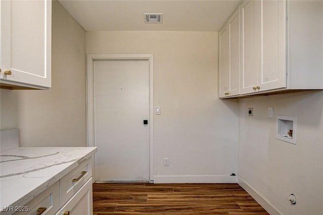 3386 El Camino Real, Las Vegas, NV 89121 - washroom featuring dark wood-style floors, cabinet space, electric dryer hookup, hookup for a washing machine, and baseboards
