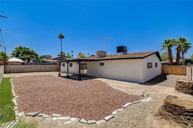3386 El Camino Real, Las Vegas, NV 89121 - rear view of property featuring a fenced backyard, a patio, and central air condition unit