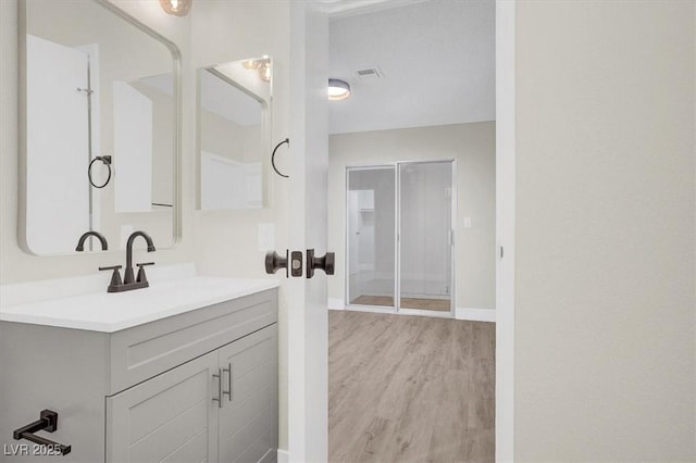 417 N Lamb Blvd Unit E, Las Vegas, NV 89110 - bathroom featuring wood finished floors, vanity, and baseboards