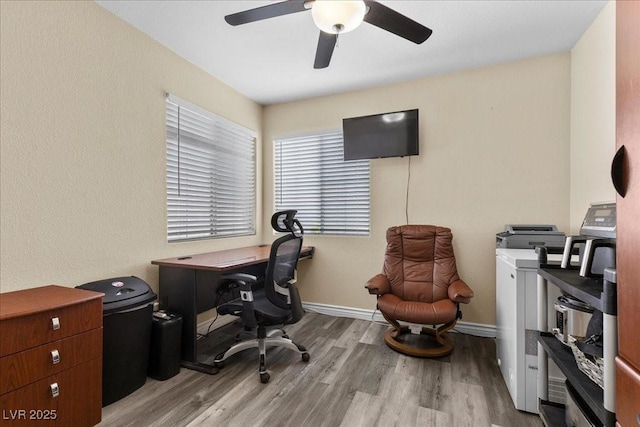 5937 Round Castle St, Las Vegas, NV 89130 - office area with light wood finished floors, ceiling fan, washer / clothes dryer, and baseboards
