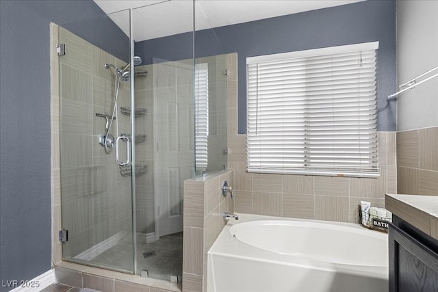 5937 Round Castle St, Las Vegas, NV 89130 - bathroom featuring a bath, a stall shower, and vanity