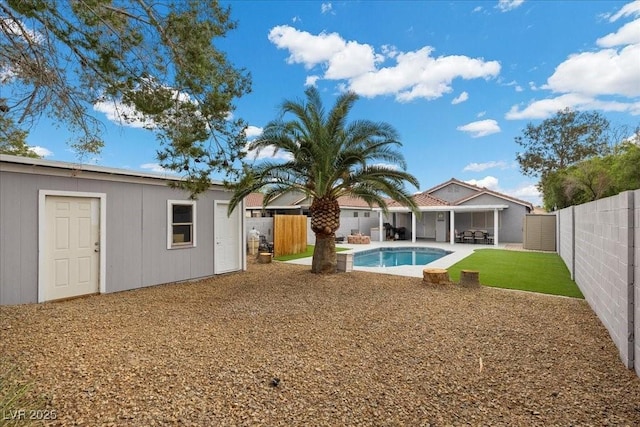 5937 Round Castle St, Las Vegas, NV 89130 - rear view of property with a fenced backyard, a patio area, and an outdoor structure