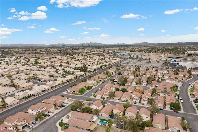 5937 Round Castle St, Las Vegas, NV 89130 - aerial view of property and surrounding area with mountains and nearby suburban area
