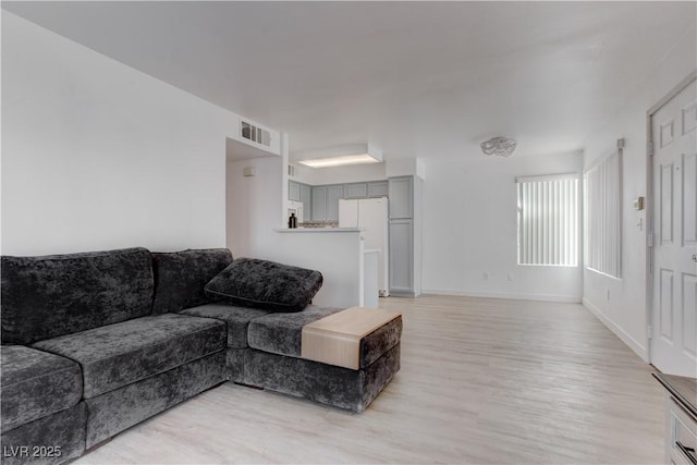 3103 Key Largo Dr Unit 103, Las Vegas, NV 89120 - living room featuring light wood-style flooring and baseboards