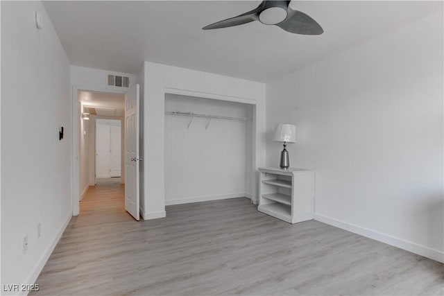 3103 Key Largo Dr Unit 103, Las Vegas, NV 89120 - unfurnished bedroom with light wood-style flooring, baseboards, a closet, and ceiling fan