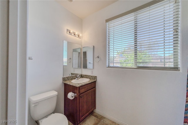 2099 Port Royal Dr, Laughlin, NV 89029 - bathroom with toilet, vanity, and baseboards