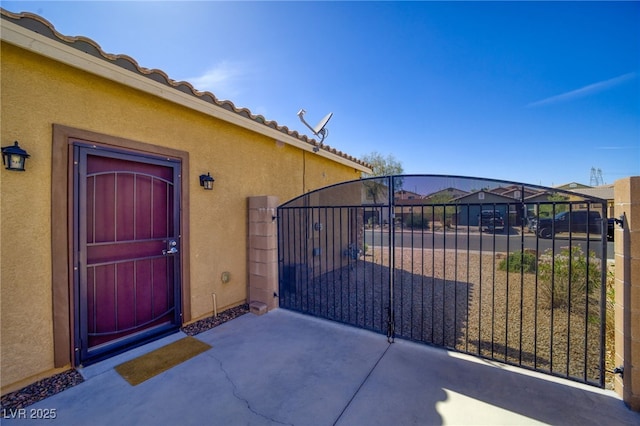 2099 Port Royal Dr, Laughlin, NV 89029 - doorway to property with a gate and stucco siding