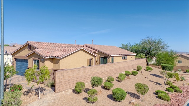 2099 Port Royal Dr, Laughlin, NV 89029 - view of front facade with stucco siding and a tile roof