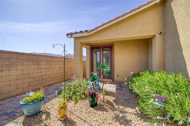 2099 Port Royal Dr, Laughlin, NV 89029 - view of exterior entry with stucco siding and a patio