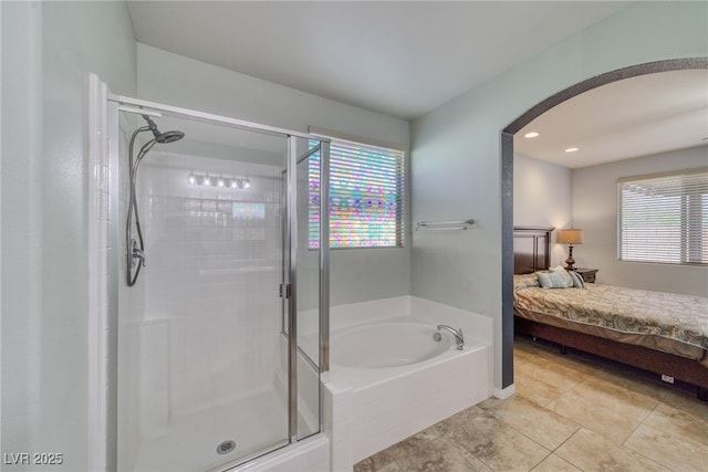 2099 Port Royal Dr, Laughlin, NV 89029 - bathroom featuring a shower stall, a garden tub, ensuite bath, tile patterned flooring, and recessed lighting