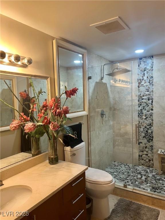 200 W Sahara Ave Unit 3510, Las Vegas, NV 89102 - full bathroom featuring a shower stall, toilet, and vanity