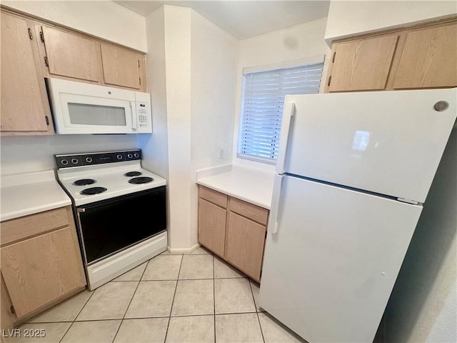 2064 Mesquite Ln Unit 102, Laughlin, NV 89029 - kitchen with white appliances, light countertops, and light tile patterned floors