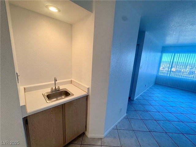 2064 Mesquite Ln Unit 102, Laughlin, NV 89029 - bathroom featuring vanity, tile patterned floors, and baseboards