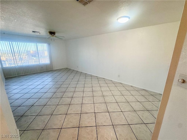 2064 Mesquite Ln Unit 102, Laughlin, NV 89029 - unfurnished room with a ceiling fan, a textured ceiling, and light tile patterned floors